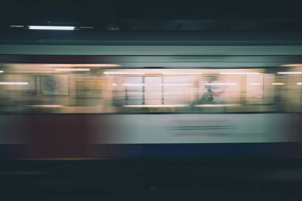A London Underground train speeding through Temple station