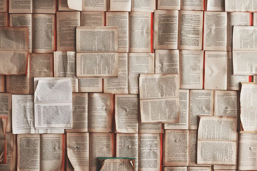 Open books spread out across a table