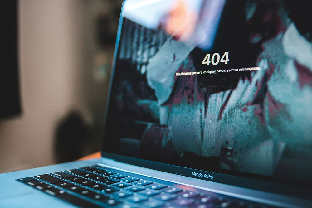 Laptop screen showing a 404 page not found error